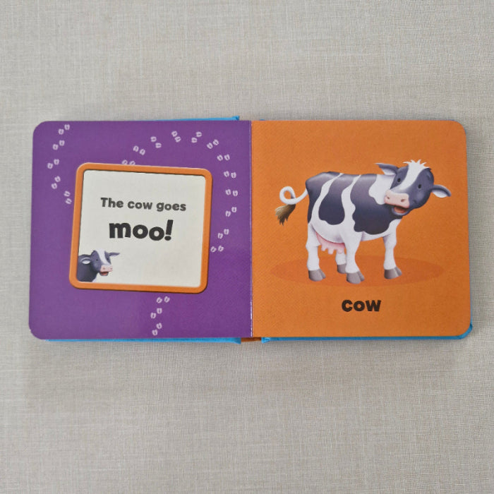 Children's book with a cow illustration on an orange and purple background