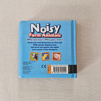 Blue back of 'Noisy Farm Animals' book on a beige fabric background