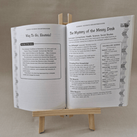 Open book on a wooden stand with text and graphics on a beige background
