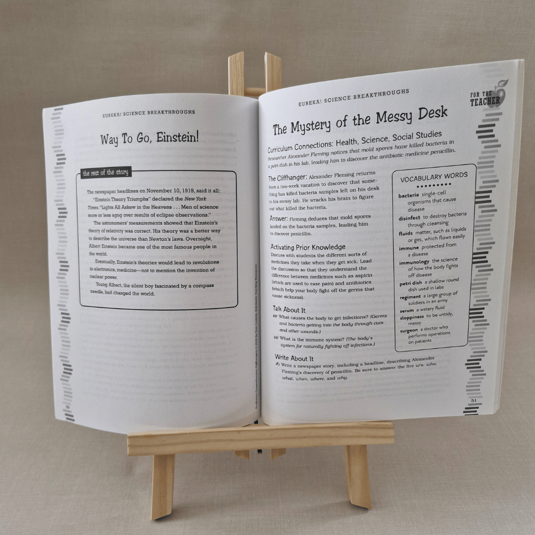 Open book on a wooden stand with text and graphics on a beige background