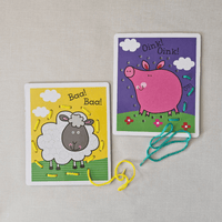 Two children's educational cards with a sheep and a pig on a beige background