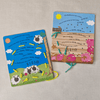 Two children's lacing cards with colourful illustrations and text on a textured surface