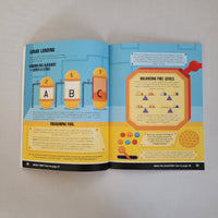Open book with educational content on a plain background