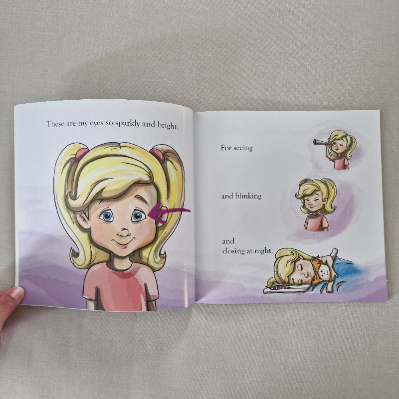 Open book with illustrations and text about a girl's eyes.