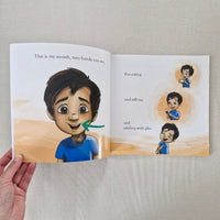 Open book showing illustrations of a child and text about the mouth.