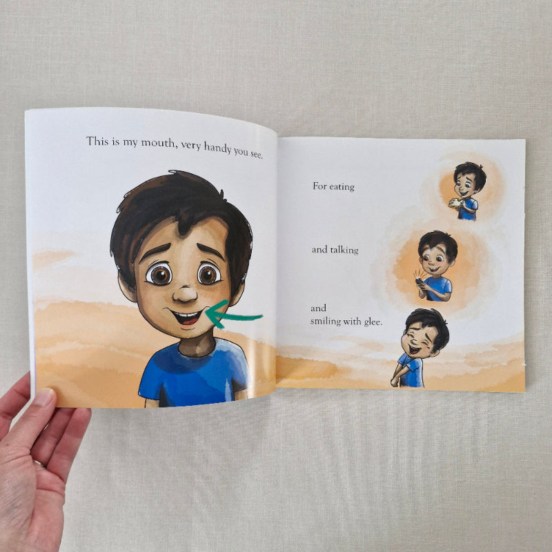 Open book showing illustrations of a child and text about the mouth.