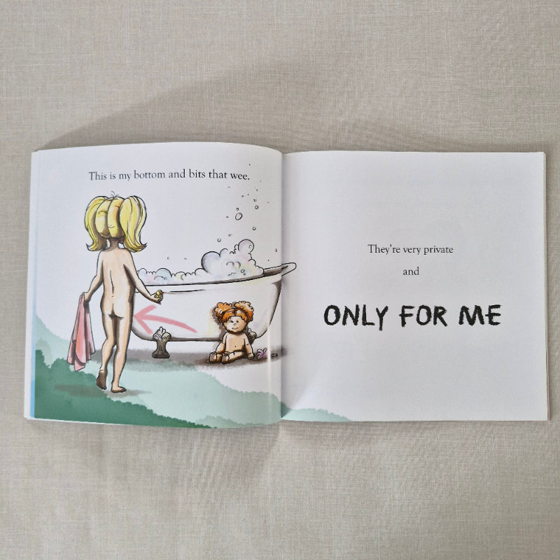 Open book showing a cartoon illustration of a child in a bathtub on a beige background.