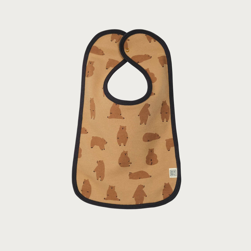 Baby bib with bear pattern on a beige background