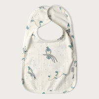 Baby bib with kereru bird pattern on a white background