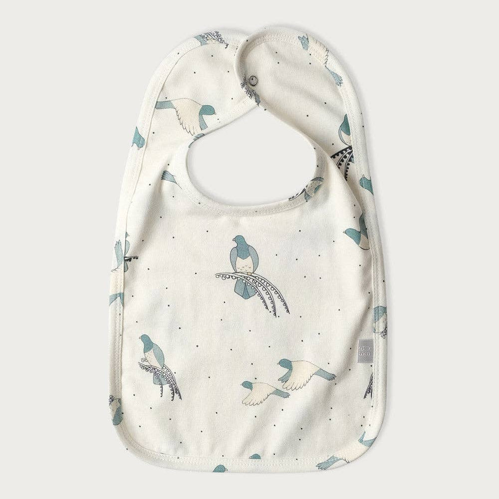 Baby bib with kereru bird pattern on a white background