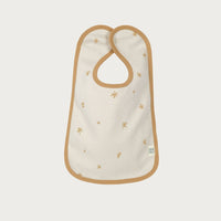 Baby bib with gold star pattern on a white background