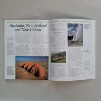 Open book with images of natural landscapes on a beige background