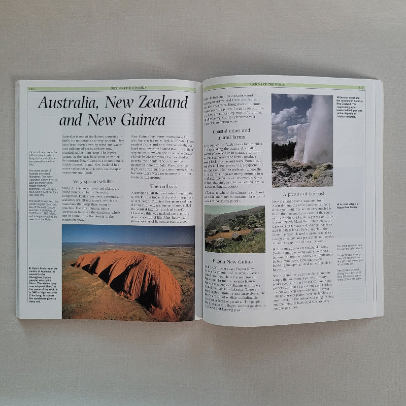 Open book with images of natural landscapes on a beige background