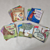 Collection of children's books on a grey surface