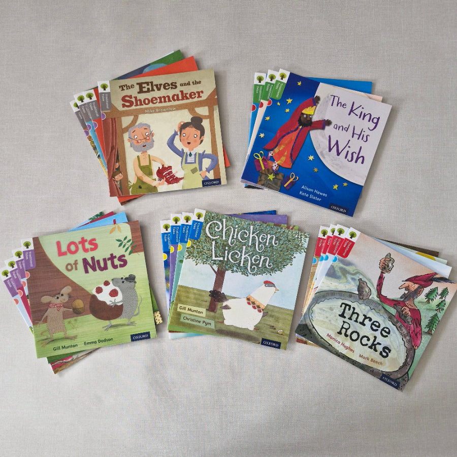 Collection of children's books on a grey surface