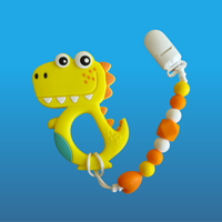 Yellow dinosaur-shaped teether on a orange pacifier clip with colorful beads on a blue background