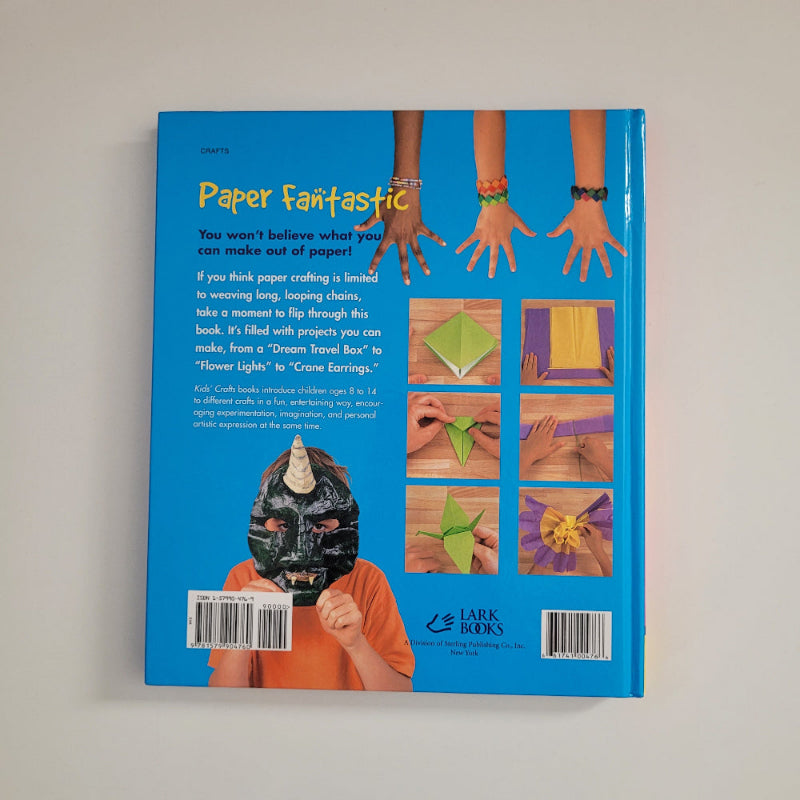 Back cover of Paper Fantastic book, showing a child with a mask, and hands with bracelets