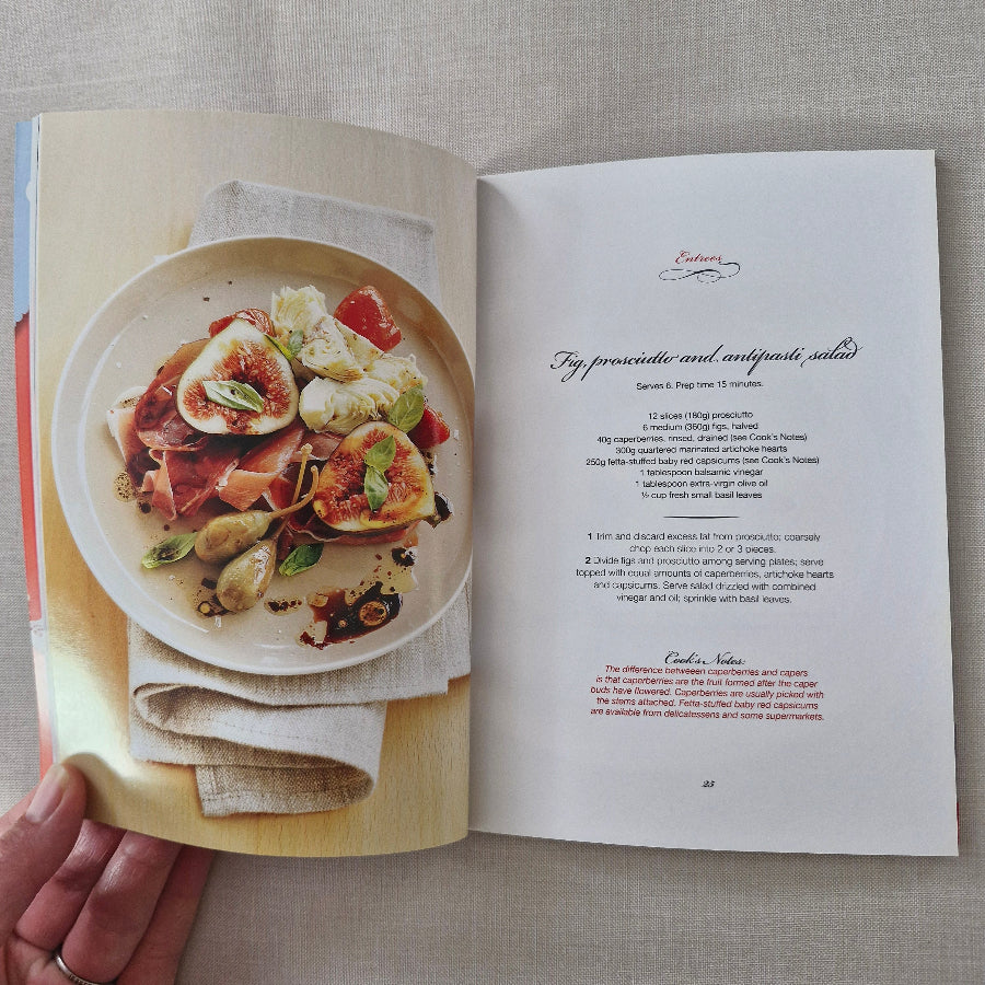 Open book showing a plate of food with a recipe underneath