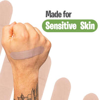 Hand with a bandage on a white background with 'Made for Sensitive Skin' text.