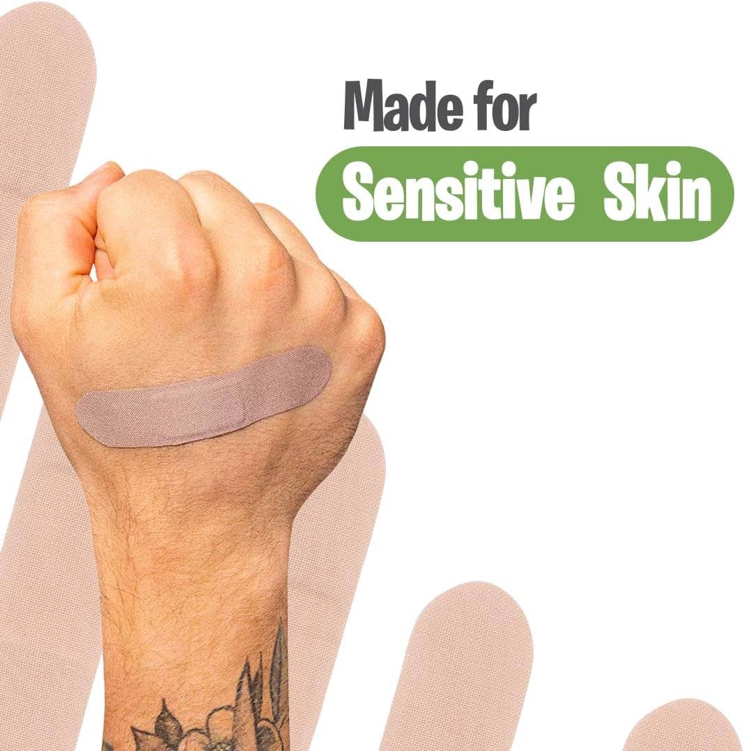 Hand with a bandage on a white background with 'Made for Sensitive Skin' text.