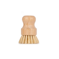 Wooden dish brush on a white background