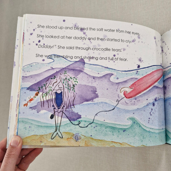 Illustrated page from a book with a purple character and red object on a beige background