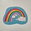 Children's puzzle with a rainbow and cloud design on a light gray background