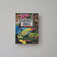 Colourful box of Rainforest Animals on a light grey background