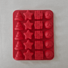 Red silicone mold with various shapes on a light grey background