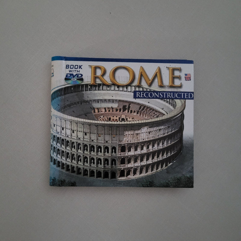 Book titled 'Rome Reconstructed' with a Colosseum image on the cover, placed on a gray surface.