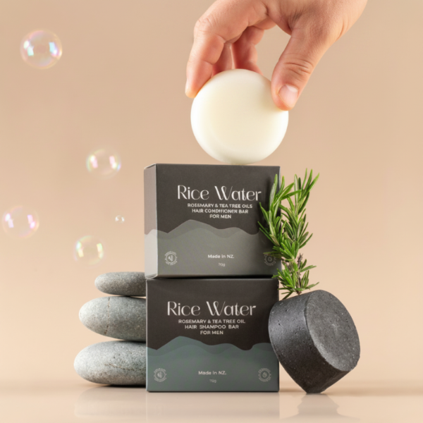 Rice Water hair care product packaging with a bar of soap and rosemary plant on a beige background