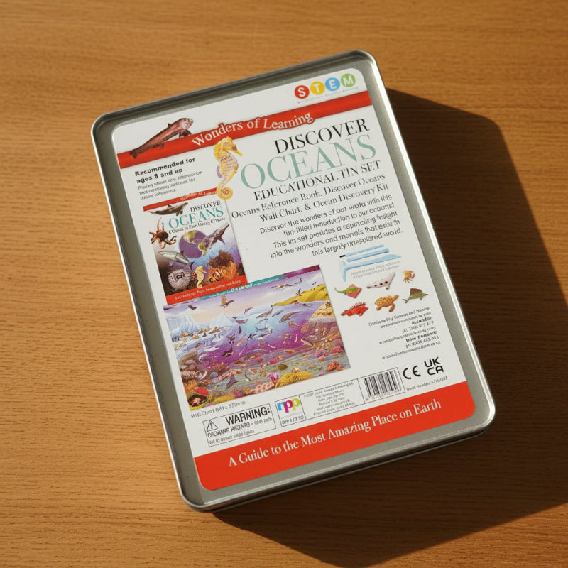 Educational kit packaging for 'Discover Oceans' on a wooden surface