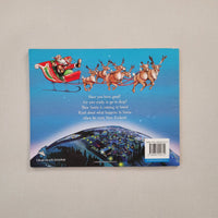 The back cover of a children's book  featuring an illustration of Santa Claus in a sleigh with reindeer against a blue sky, 