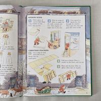 Open book with Christmas-themed activities and illustrations on a textured surface.