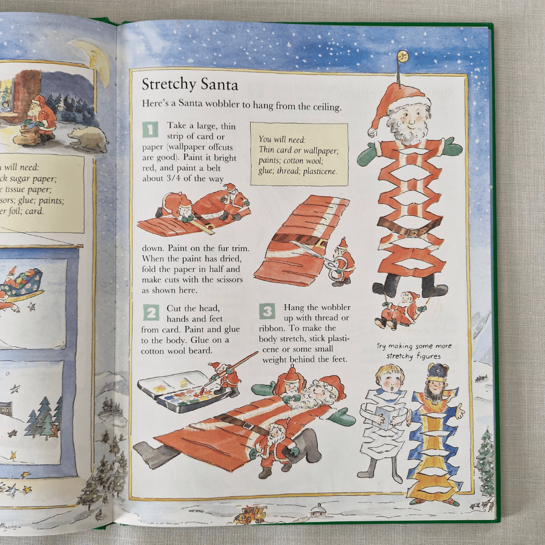 Open book with a craft project for Stretchy Santa on a textured surface