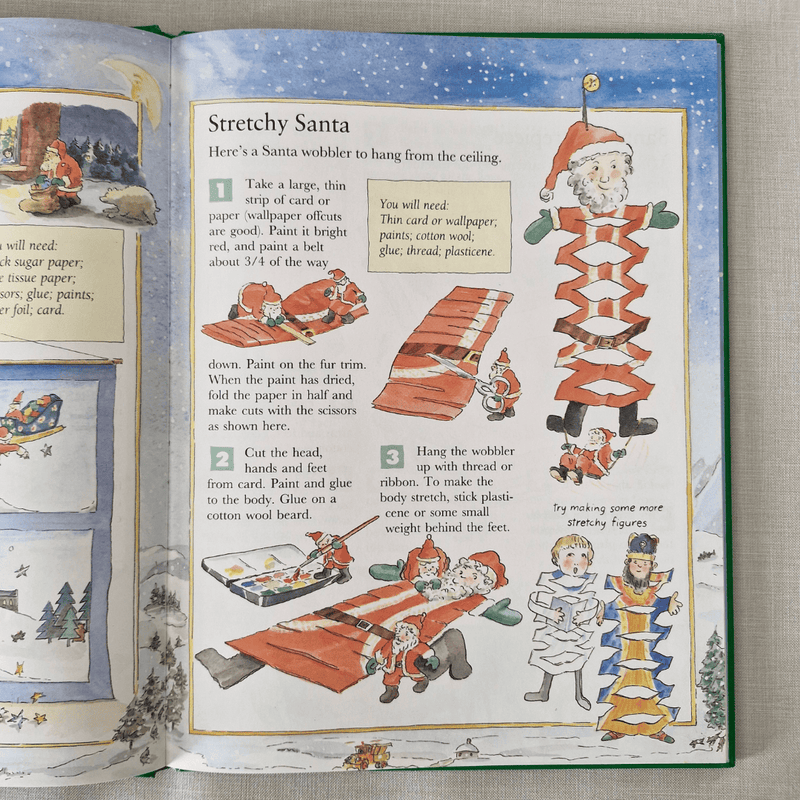 Open book with a craft project for Stretchy Santa on a textured surface