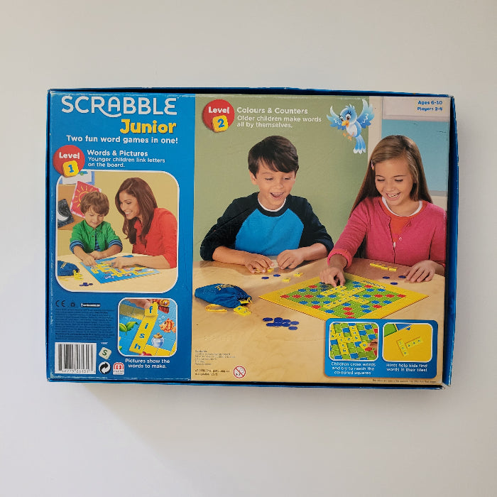 Scrabble Junior board game packaging with children playing on a white background