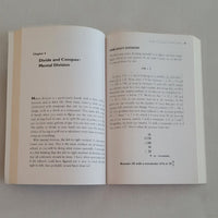 Open maths book on a plain background