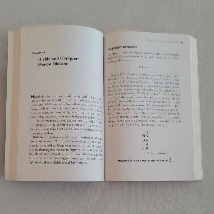 Open maths book on a plain background