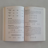Open book on a gray background with text and mathematical equations.