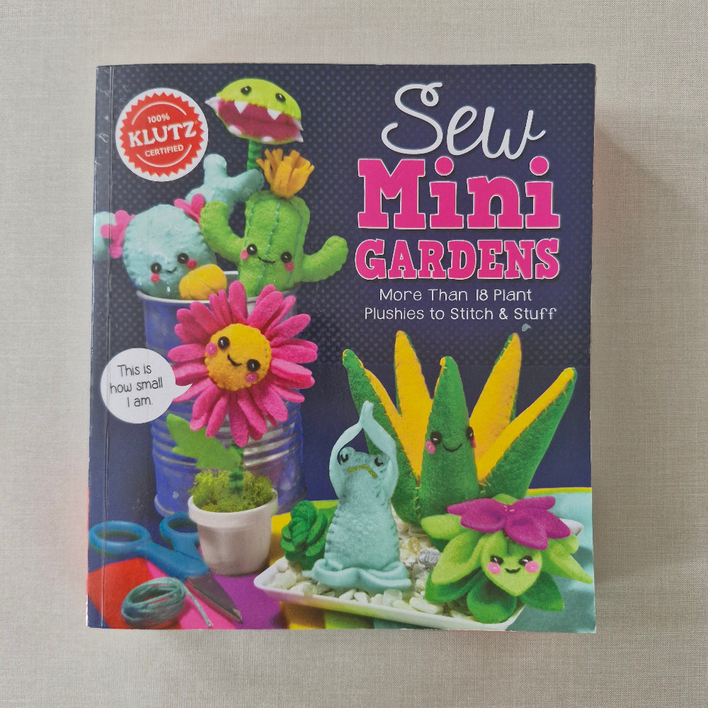 Book titled 'Sew Mini Gardens' with colourful illustrations of plants and sewing tools on a beige background.