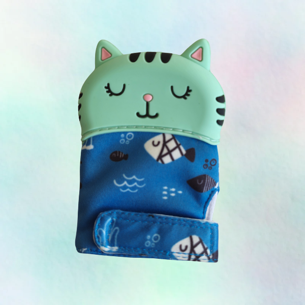 A silicone teething mitt designed to resemble a cat, with a blue patterned sleeve and a white silicone top.