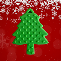 Christmas tree shaped teether for babies on a red background