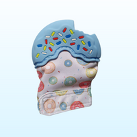 Silicone blue teething mitt in the shape of a donut with sprinkles