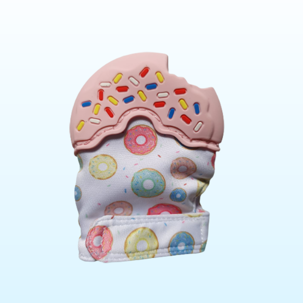 Silicone pink teething mitt in the shape of a donut with sprinkles