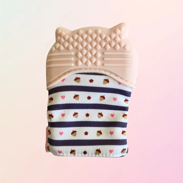 Reverse side of pink raccoon teething mitt on white background