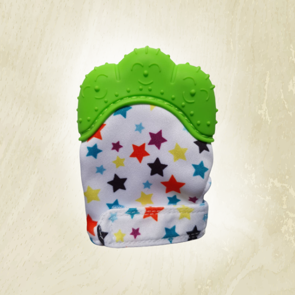 A green teething mitt with a star pattern, primarily in white with orange accents, designed to fit on a baby's hand.