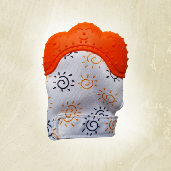 A teething mitt with a sun and rays pattern, primarily in white with orange accents, designed to fit on a baby's hand.