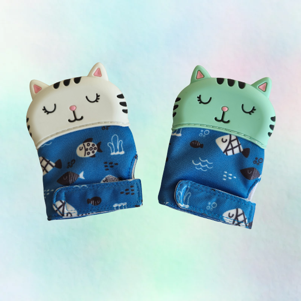 White and Green Cat shaped silicone  teething mitts on a white background