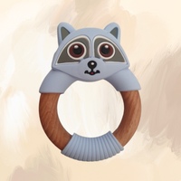 A blue silicone teething ring designed to resemble a raccoon, with a wooden central ring. 